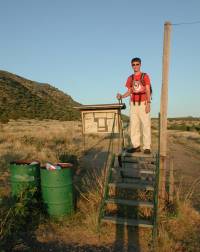 Nathan on the Stile with Style at the Black Mesa Trailhead