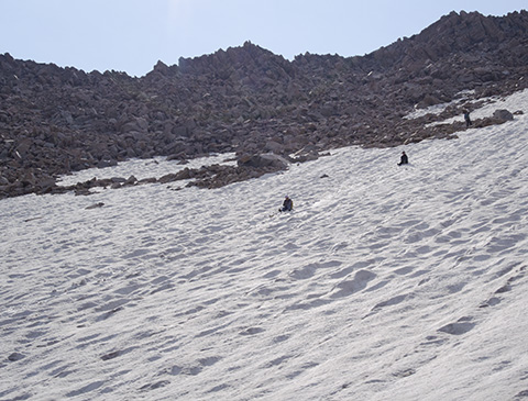 Glissading Down the a Snowfield on Granite Peak