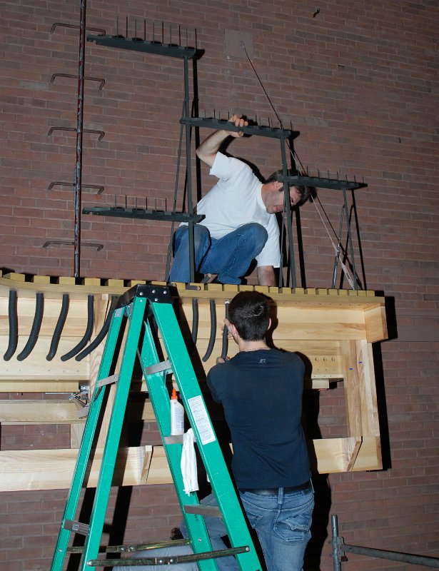 DSC_4833.JPG - Mounting support racks for the antiphonal facade pipes.
