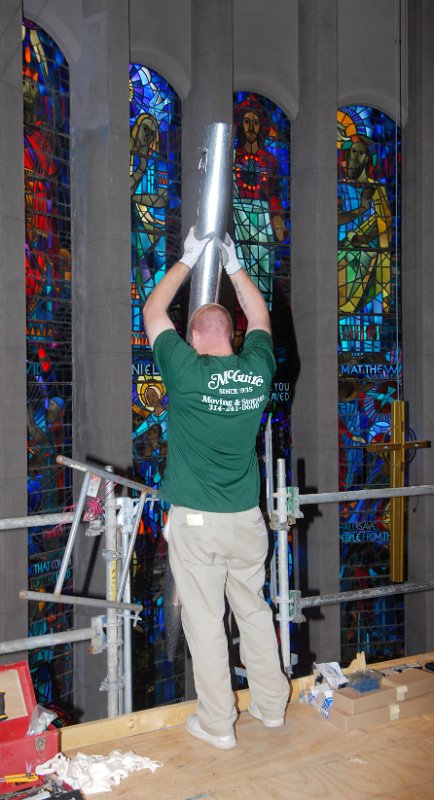 DSC_5781.JPG - Handing up pipes for the pulpit-side pipe chamber.