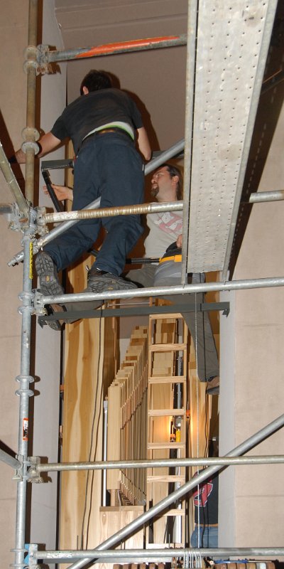 DSC_5991.JPG - Up high, mounting the upper pipe racks on the lectern-side columns.