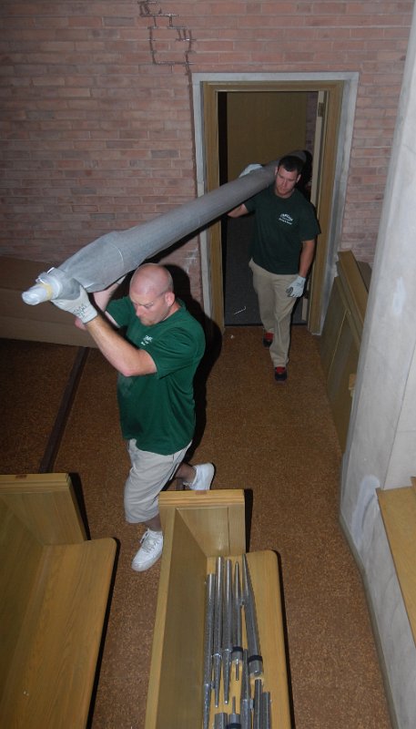 DSC_4750.JPG - Carrying 16' antiphonal pipes into the balcony.