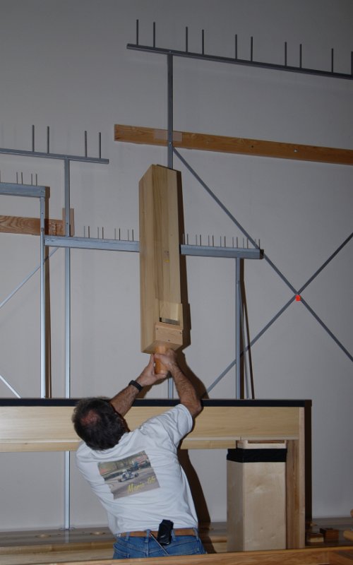 DSC_5173.JPG - Mounting wooden pipes.  First, hooked to the pipe rack.