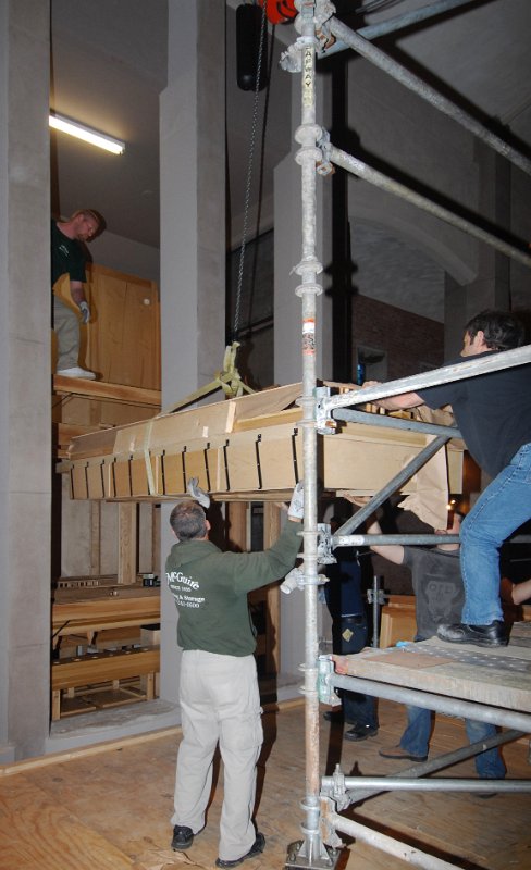 DSC_5753.JPG - Raising the largest wind chest into the lectern-side pipe chamber.